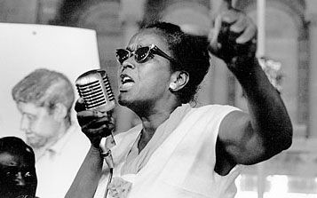 Ella Baker Ella Baker passionately speaking into a mic